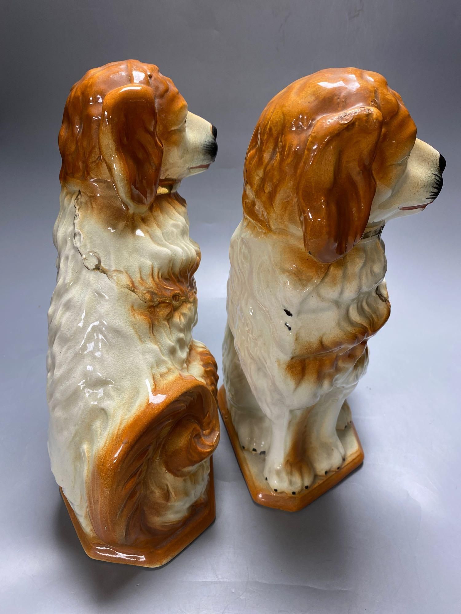 A pair of modern Staffordshire pottery dogs, 33cm